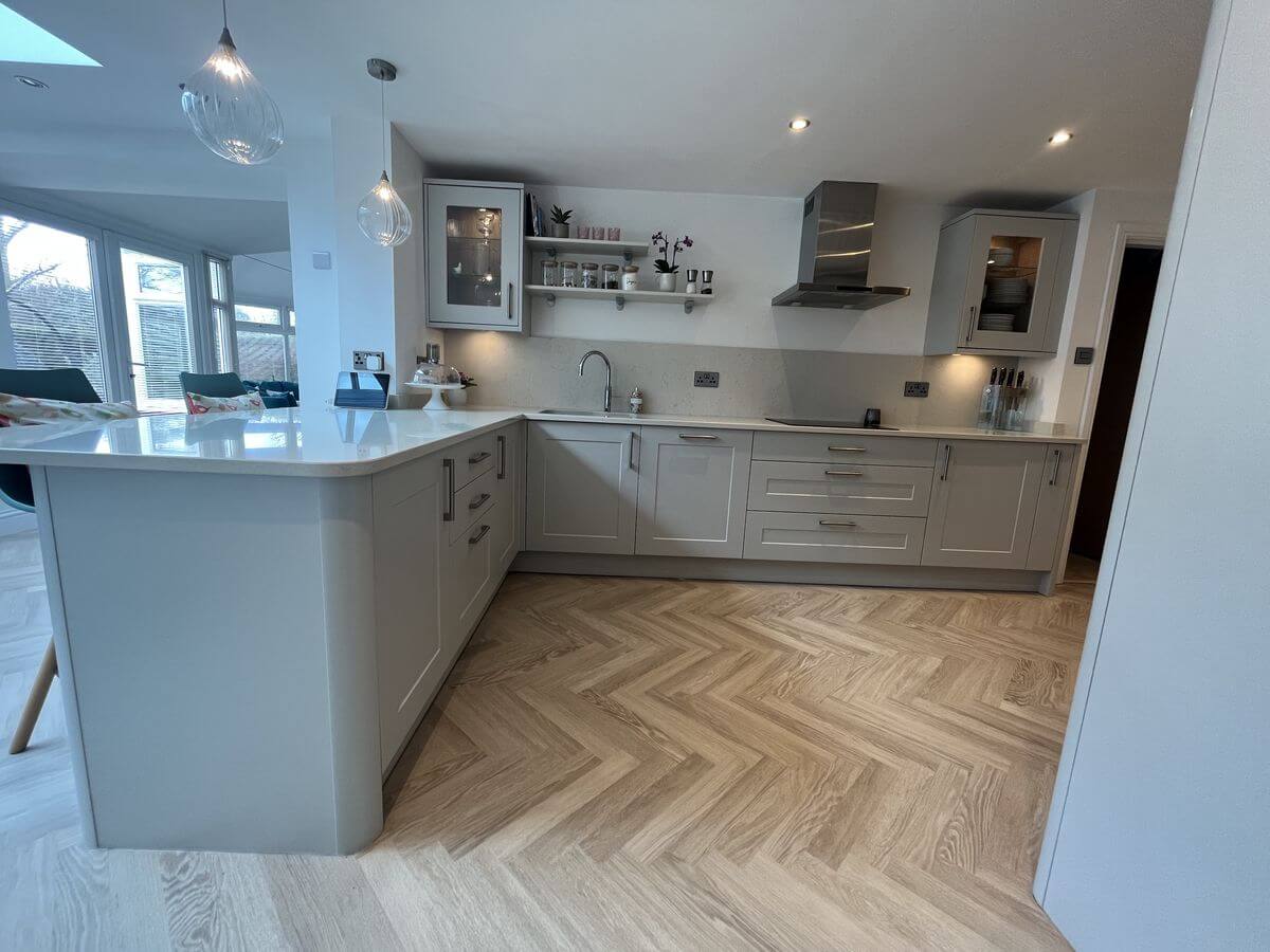 Light grey shaker kitchen with stone worktops