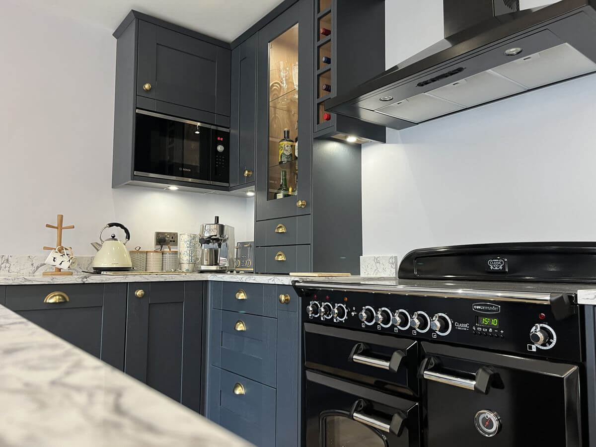 Modern kitchen installation with backlit glass display cupboards